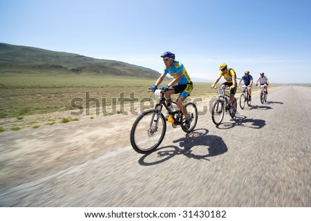ALMATY, KAZAKHSTAN - MAY 1: Nurlan Tlegenov (N17) in action at Adventure mountain bike cross-country marathon in desert 