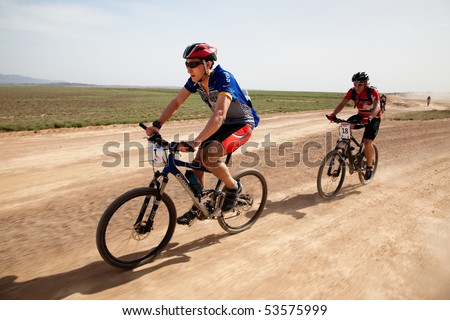 ALMATY, KAZAKHSTAN - MAY 2: J.Satkynaliev (N1)  in action at Adventure mountain bike marathon in desert 
