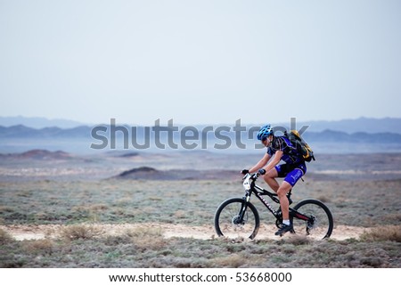 ALMATY, KAZAKHSTAN - MAY 1: I. Popov (N11) in action at Adventure mountain bike marathon in desert \