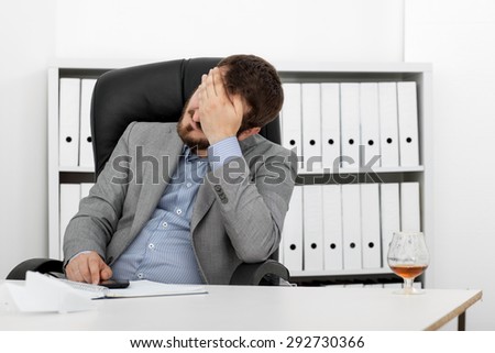 Man tired businessman at his desk
