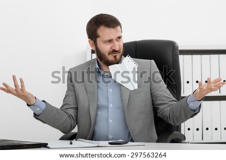 happy man businessman at his desk let a paper airplane