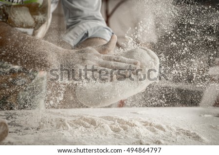 Similar – Image, Stock Photo Kneading pizza dough on green table. Making dough at home