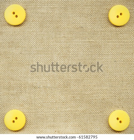 Yellow buttons on the beige fabric
