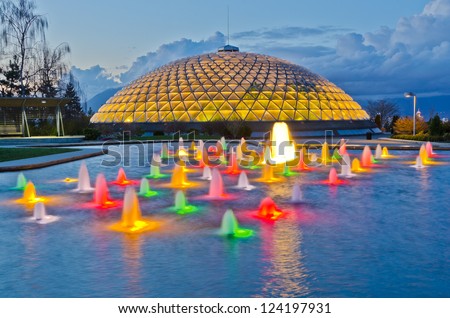Night view at fountain in Queen Elizabeth park over mountain and cloudy sky in Vancouver, Canada.