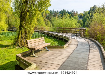 Trail tand bench in Deer Lake Park, Vancouver, Canada.
