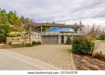 Luxury house in Vancouver, Canada. Limited number of colours. Brown, grey and green.