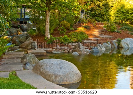Outdoor landscape garden with pond in North Vancouver, British Columbia, Canada. Sunset light.