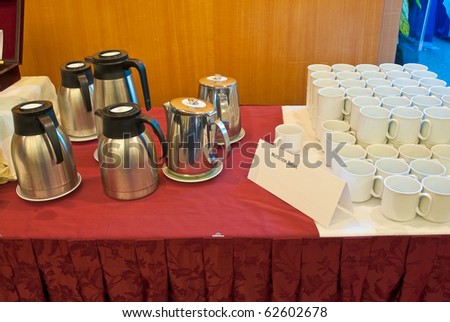 Catering or buffet party on business seminar conference. Shallow depth of field. Focus on the closest cups.