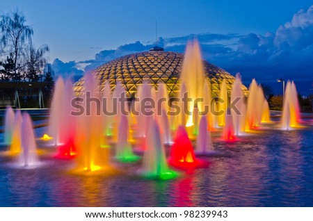 Night view at fountain in Queen Elizabeth park over mountain and cloudy sky in Vancouver, Canada.