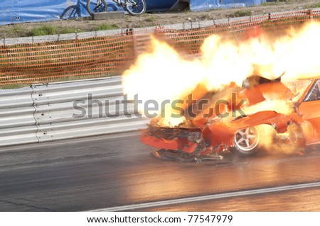 GARDERMOEN RACEWAY, NORWAY - MAY 14: Race car explodes into flames during a drag race on May 14,2011 at Gardermoen Raceway, Norway. The car disintegrates in a ball of fire.