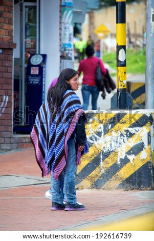 BOGOTA, COLOMBIA - MAY 06, 2014: A native Colombian woman wearing a poncho. Ponchos have been used by the Native American peoples of the Andes since pre-Hispanic times.