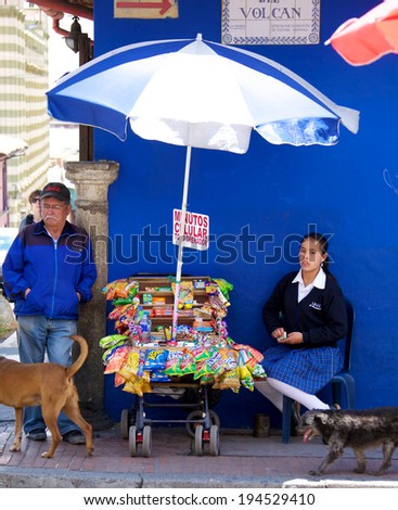 BOGOTA, COLOMBIA - MAY 06, 2014: Vendors selling food drinks and snacks along a busy street in Bogota. Street vendors are very common in the streets of Bogota.