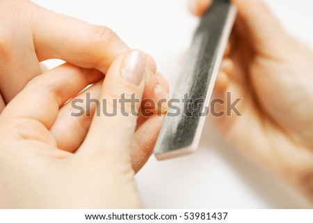 Studio nail - beautician polishing nails