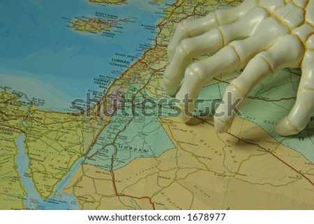 Map of Israel and Lebanon with a hand of bone on it.