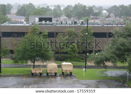 Hurricane Gustav winds and rain batter military vehicles and trees in New Orleans, Louisiana.