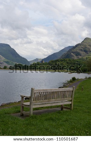 A bench face toward a lake in Llanberis.