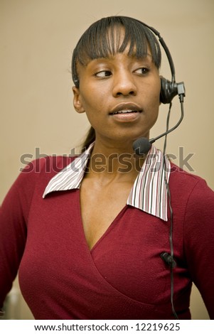 An attractive African American customer support representative, office worker or business woman.