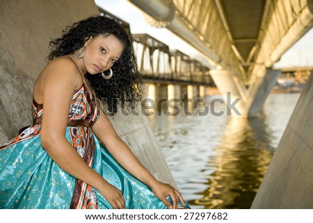 African-american Fashion model shot in an urban setting on a waterfront.