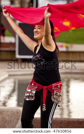 SCOTTSDALE, AZ - JANUARY 23: An un-identified participant in a belly dance demonstration at Scottsale\'s Fit City Event (which encourages physical fitness awareness) on January 23rd 2010 in Scottsdale, AZ.