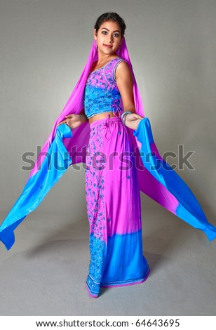 An Indian woman shows off her colorful sari