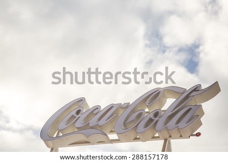 BUCHAREST, ROMANIA - June 18,2015: To celebrate the 100th birthday of the Coca-Cola contour bottle, a pop-up store will be open at University Square in Bucharest. Logo of Coca-Cola Company.