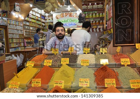 ISTANBUL - MAY 04: Seller posing in Egyptian Bazaar (Spice Bazaar) on May 04, 2013 in Istanbul, Turkey. Located in Eminonu is the second largest covered shopping complex after Grand Bazaar.