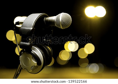 live music  background.Headphones and microphone on the stage