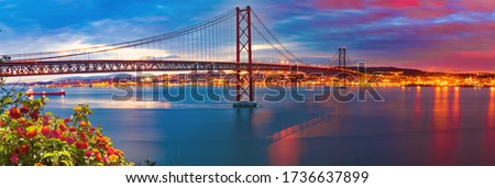 Lisbon landscape at sunset.Panoramic photograph of the 25 de Abril bridge in the city of Lisbon over the Tajo River. Foto stock © 