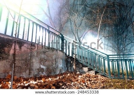 City night scene, fog and stairway.Old wall and fence