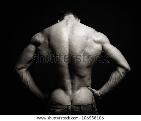 free photos muscle man back on black background avopix com