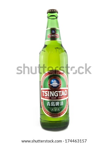 SWINDON, UK - FEBRUARY 2, 2014:  640ml Bottle of Tsingtao Beer on white background, Tsingtao Beer comes from China