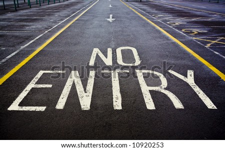 No entry sign painted on road