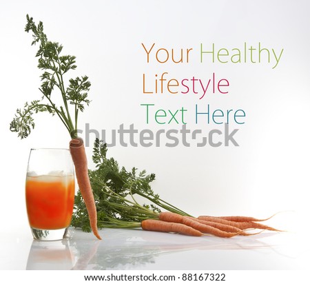 fresh carrot juice in glass isolated on white background with copy space for text