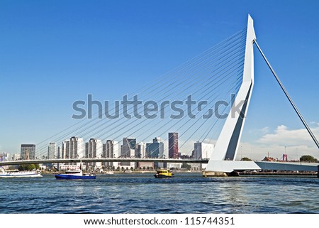 ROTTERDAM, NETHERLANDS - SEPTEMBER 09: View on Erasmus Bridge and Rotterdam port. Erasmus Bridge is one of the icons of Rotterdam on September 9, 2012 in Rotterdam, The Netherlands