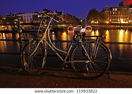 Old dutch bike at the Amtel in Amsterdam in the Netherlands by night