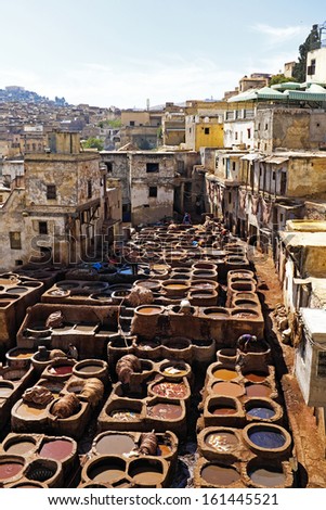 Tanners working leather in the old tannery of Fes, Morocco
