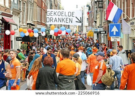 AMSTERDAM - APRIL 26: Streets of Amsterdam full of people in orange during the celebration of kings day on April 26, 2014 in Amsterdam, The Netherlands