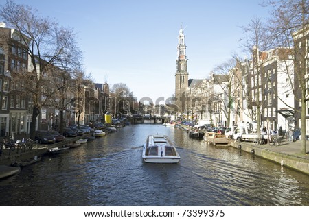 Cruising in Amsterdam with the Westerkerk in the Netherlands