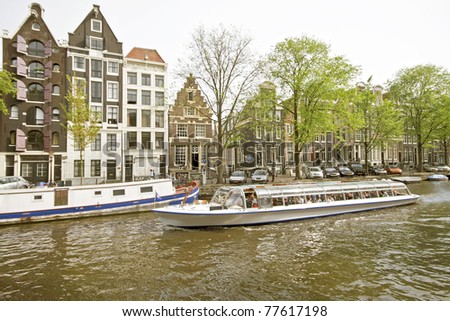 Cruising through Amsterdam canals in the Netherlands