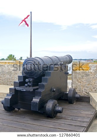 Old canon aiming at the sea, on an overcast day. Old Castillo de San Marcos, St. Augustine, Florida