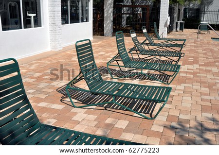 Green pool chairs in line