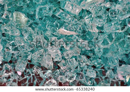 Shattered glass on a gray floor as background