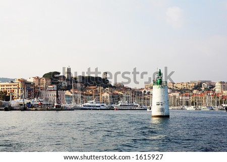 The harbor (Port Le Vieux) in Cannes, France, with the Musee de la Castre and  La Tour du Suquet in the background.