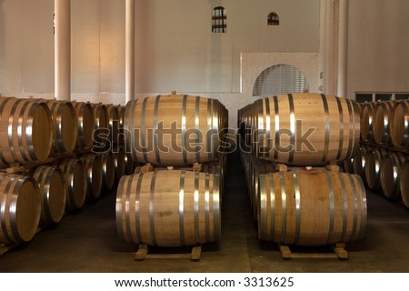 Stacked Oak barrels for maturing red wine and brandy in a cooling cellar. Made from American and Canadian oak and stacked in rows. (low noise HDR file – no noise reduction filters/software used)