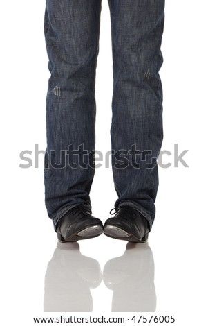 Single male tap dancer wearing jeans showing various steps in studio with white background and reflective floor. Not isolated