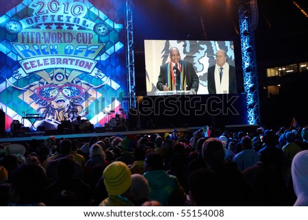 SOWETO - JUNE 10: Fans watch the opening speech of FIFA President Joseph Blatter and South African President Jacob Zuma for the FIFA World Cup Kick Off Celebration Concert on June 10, 2010 in Soweto