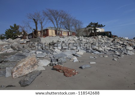 NEW YORK - NOVEMBER 12:Pile of garbage, debris near flooded and damaged house after Hurricane Sandy  on Manhattan Beach on November 12, 2012, Brooklyn, NY