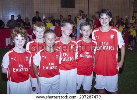 New York, NY, USA - July 25, 2014: Young Arsenal Football Club fans attend the PUMA partners with Arsenal Football Club to Debut Monumental Cannon event in Grand Central Station in New York City.