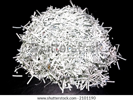 Shredded paper documents on the black table