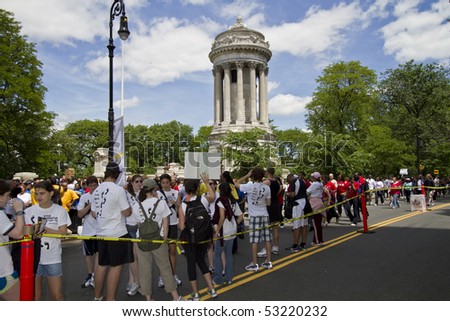 NEW YORK - MAY 16: People participating to the AIDS Walk 2010 walking down Riverside Drive near soldiers memorial on May 16, 2010 in New York City.